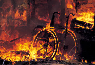 Burning wheelchair after evacuation