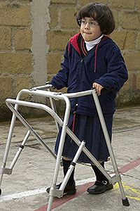 Child with an ambulant disability using a walking frame