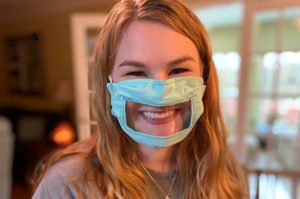 Smiling with a covid 19 mask on