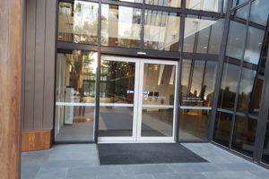 Aluminium framed building entry with good luminance contrast to doors